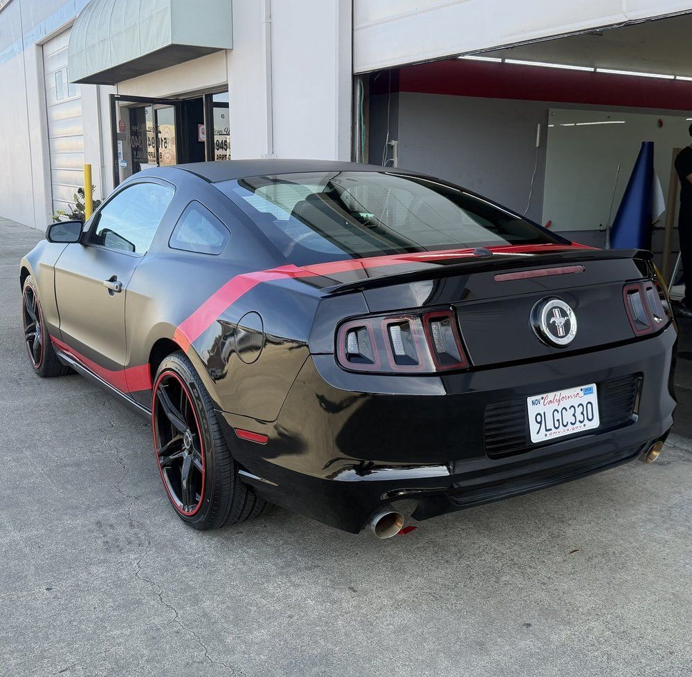 Aaron P. custom wrapped Mustang rear