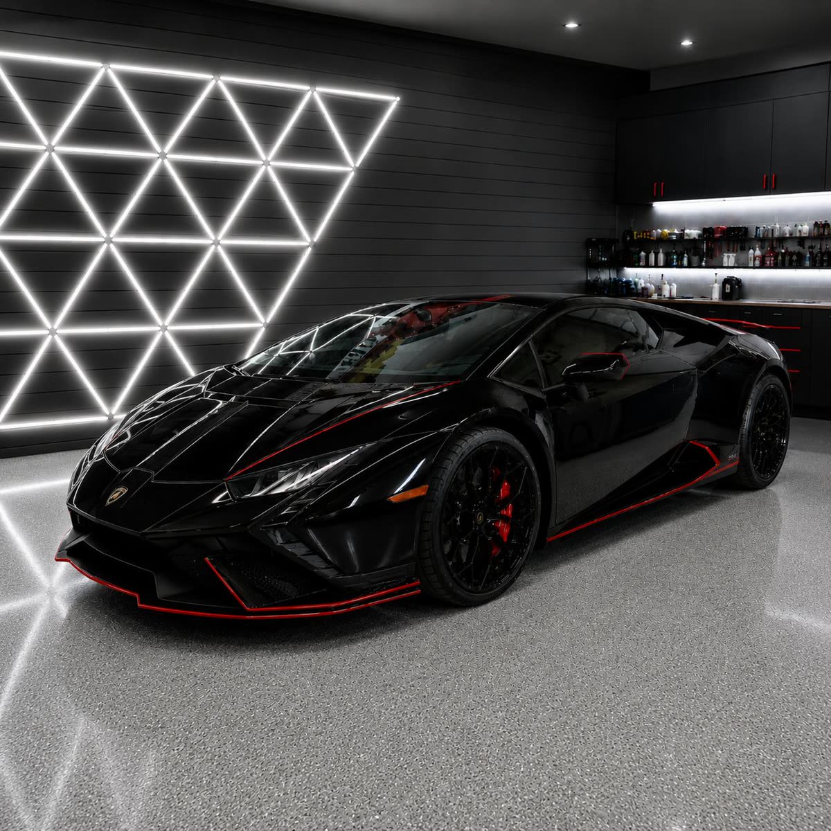 Black Lamborghini Huracan with red accent trim inside the Clean Wrap Customs studio