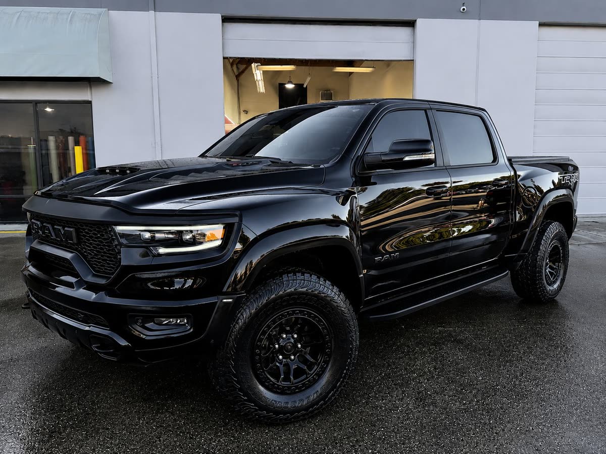 Black Ram TRX pickup with a deep gloss finish parked outside the Clean Wrap Customs shop
